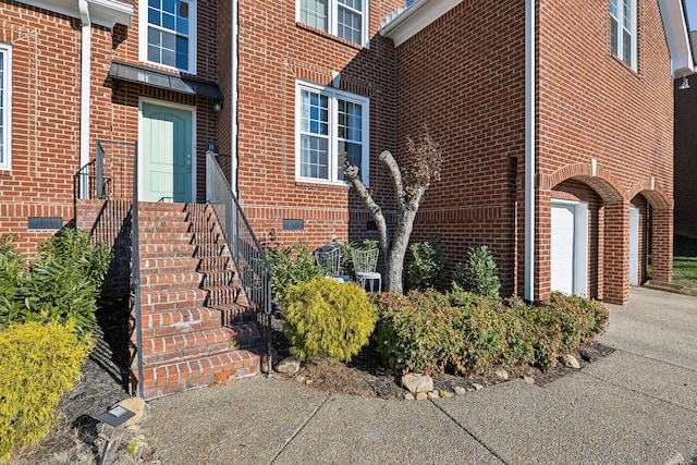 view of exterior entry featuring a garage