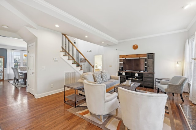 living room featuring dark hardwood / wood-style floors and ornamental molding