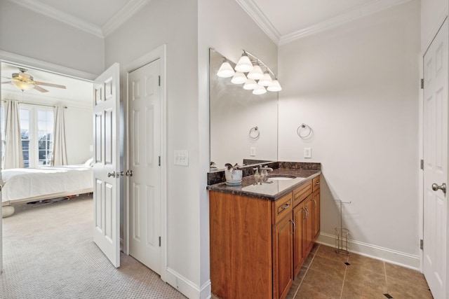 bathroom featuring ceiling fan, vanity, and ornamental molding