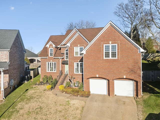 view of front facade with a front lawn and a garage