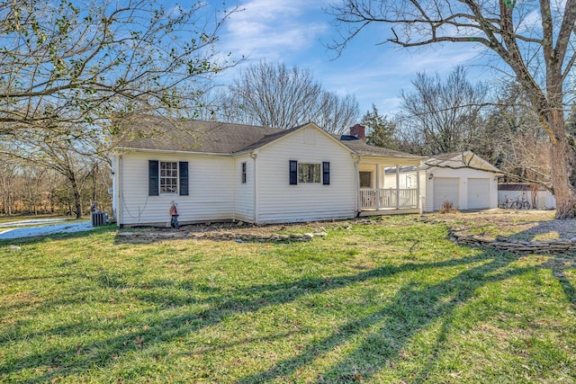 view of front of house featuring central AC, a front lawn, a porch, and a garage