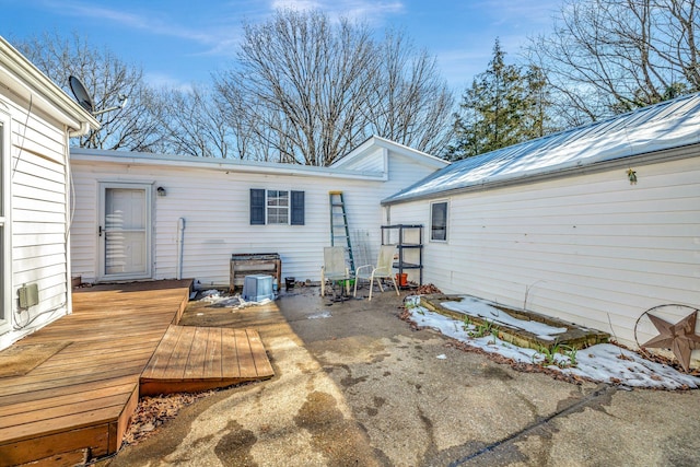 rear view of house with a deck and a patio area