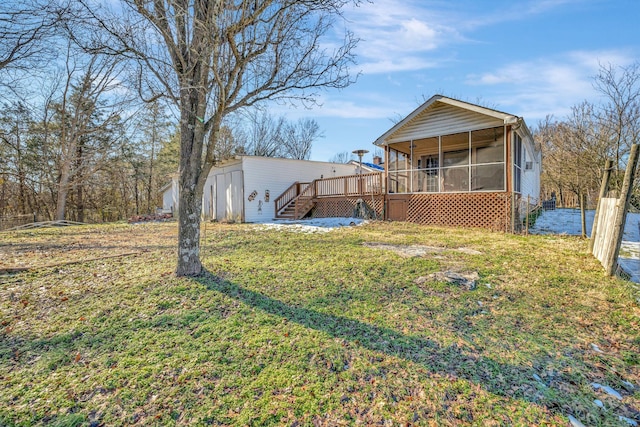 view of yard with a wooden deck and a sunroom