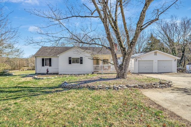 single story home with a garage, a front yard, an outdoor structure, and covered porch