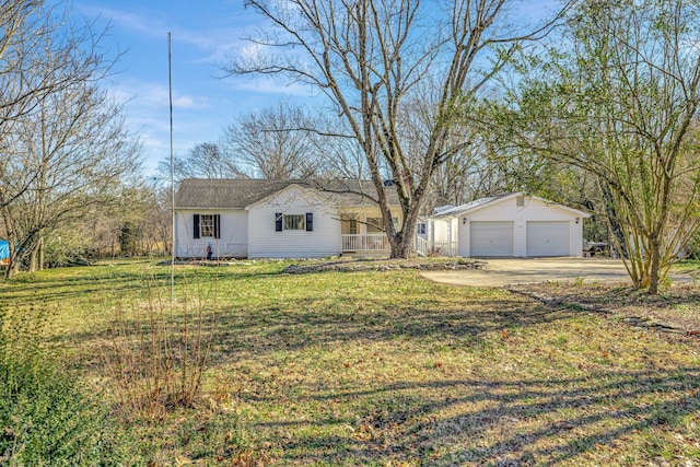 ranch-style home featuring a garage and a front lawn