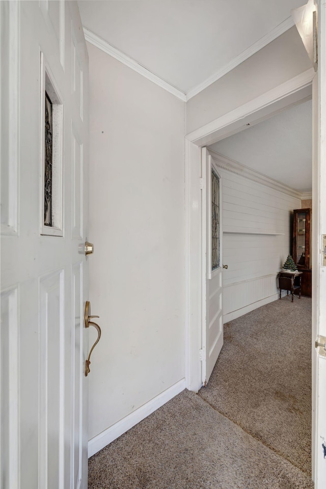 corridor featuring carpet and crown molding