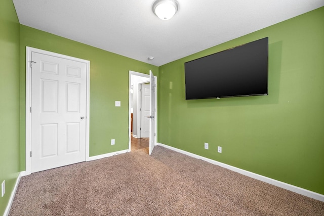 unfurnished bedroom with carpet floors