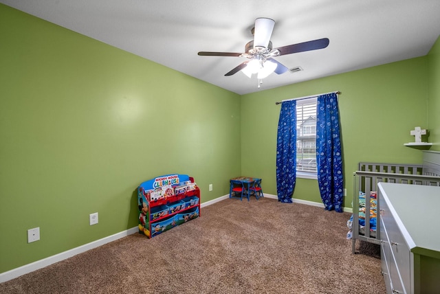 game room with ceiling fan and carpet