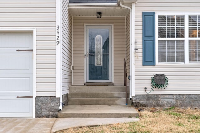 entrance to property with a garage