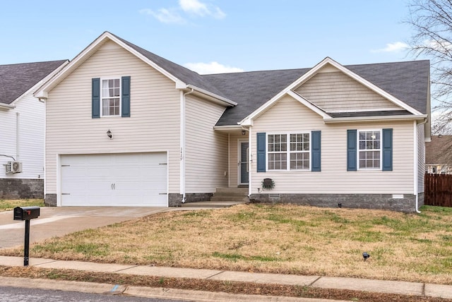 view of front of home featuring a garage and a front yard