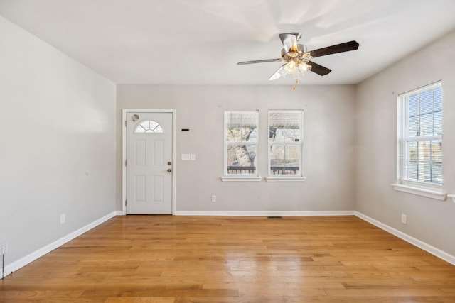 entryway with ceiling fan and light hardwood / wood-style flooring