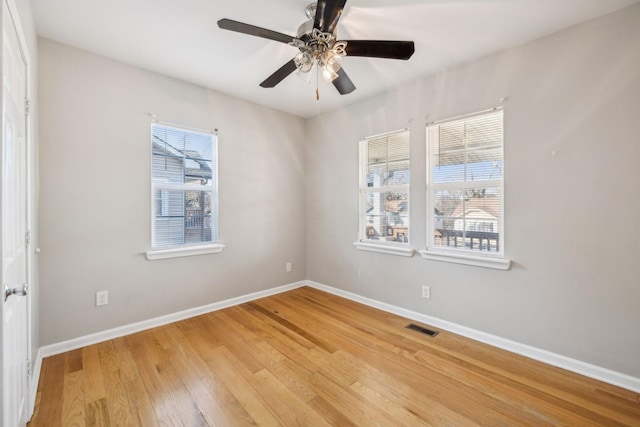 unfurnished room with ceiling fan and light hardwood / wood-style floors