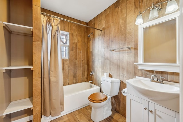 full bathroom featuring wood-type flooring, toilet, vanity, and shower / bath combination with curtain