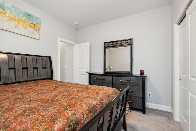 carpeted bedroom featuring a closet