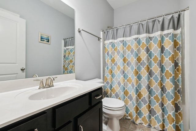 bathroom with toilet, a shower with shower curtain, tile patterned floors, and vanity