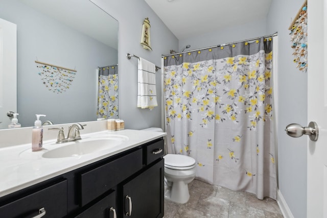 bathroom with curtained shower, toilet, and vanity