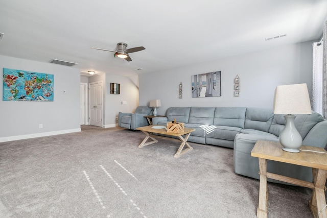 carpeted living room with ceiling fan