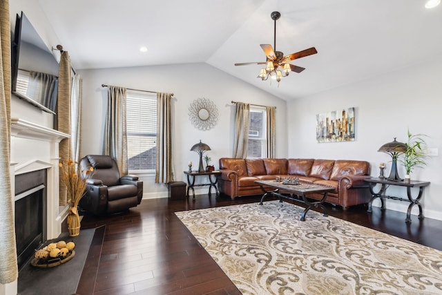 living room with ceiling fan, dark hardwood / wood-style flooring, and lofted ceiling