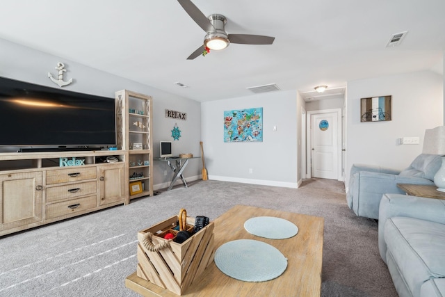 living room with ceiling fan and carpet flooring