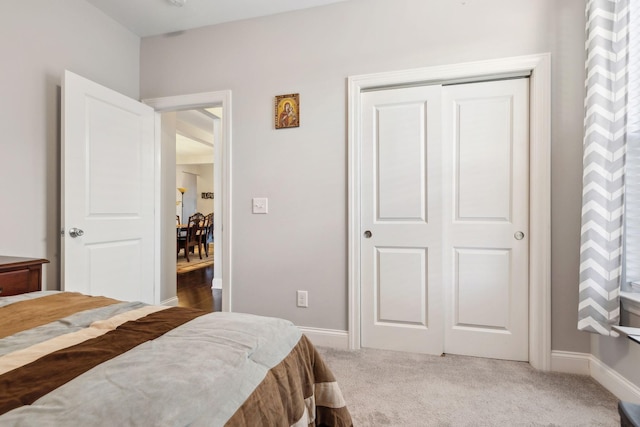 bedroom with a closet and carpet flooring