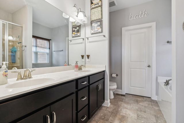 full bathroom featuring toilet, separate shower and tub, and vanity