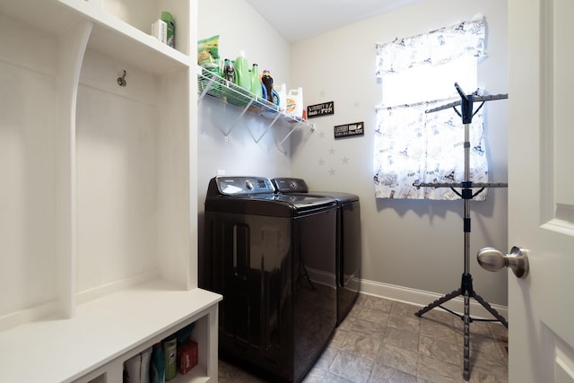 clothes washing area with washing machine and dryer