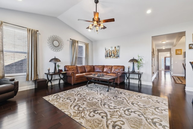 living room with lofted ceiling, ceiling fan, and dark hardwood / wood-style flooring