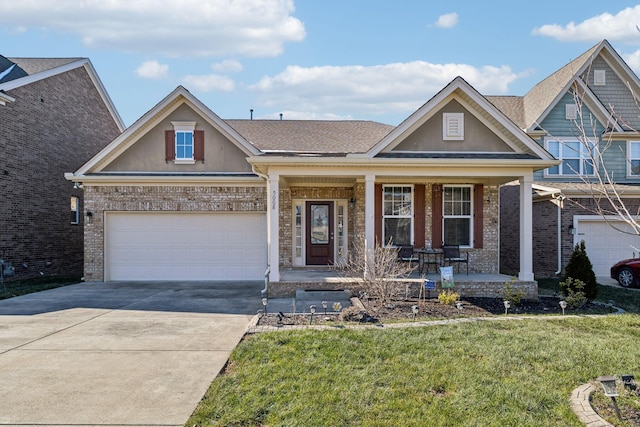 view of front of home with covered porch and a front yard