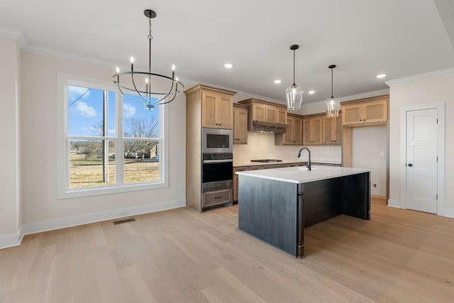 kitchen featuring a kitchen island with sink, visible vents, light countertops, appliances with stainless steel finishes, and tasteful backsplash