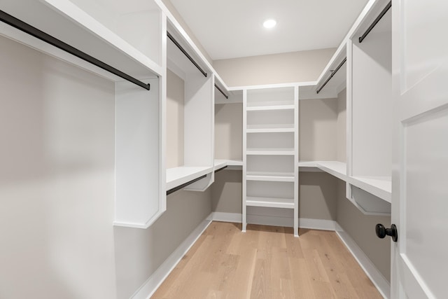 spacious closet with light wood finished floors