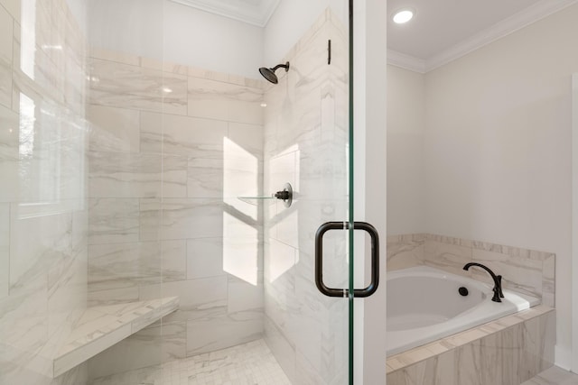 bathroom featuring ornamental molding, a shower stall, and a bath