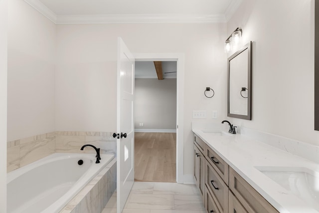 full bathroom featuring a garden tub, a sink, baseboards, double vanity, and crown molding