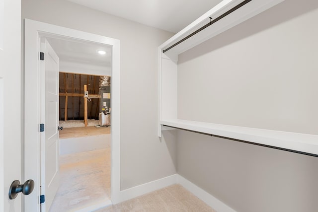 spacious closet featuring gas water heater