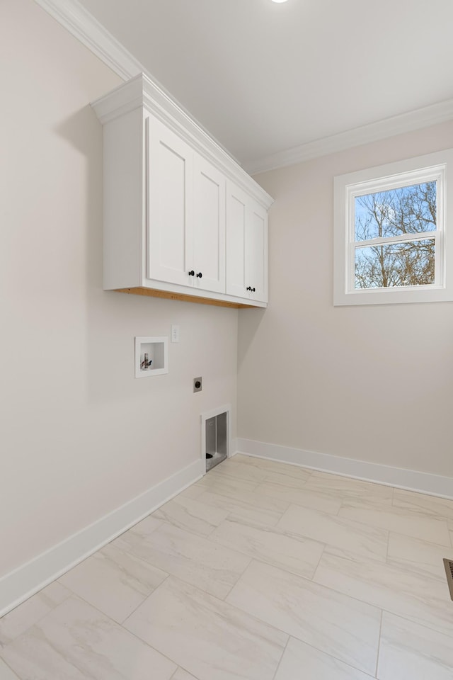 laundry room featuring cabinet space, baseboards, ornamental molding, and hookup for an electric dryer