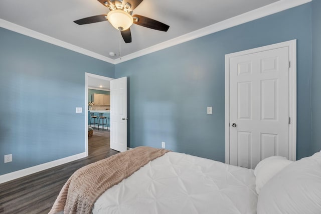 bedroom featuring ceiling fan, ornamental molding, and dark hardwood / wood-style flooring