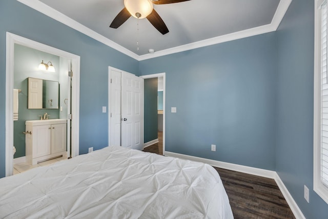 bedroom with ceiling fan, sink, ensuite bathroom, and crown molding