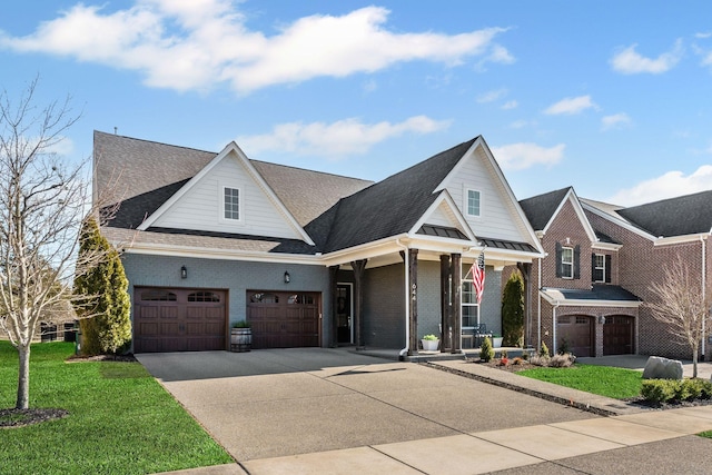 view of front of property featuring a garage and a front lawn