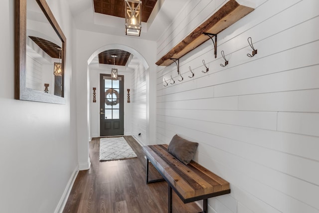 mudroom featuring dark hardwood / wood-style floors and a raised ceiling