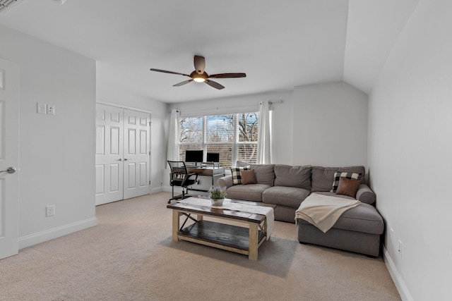 living room with lofted ceiling, light colored carpet, and ceiling fan