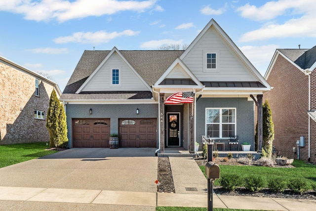 view of front facade with a garage and covered porch