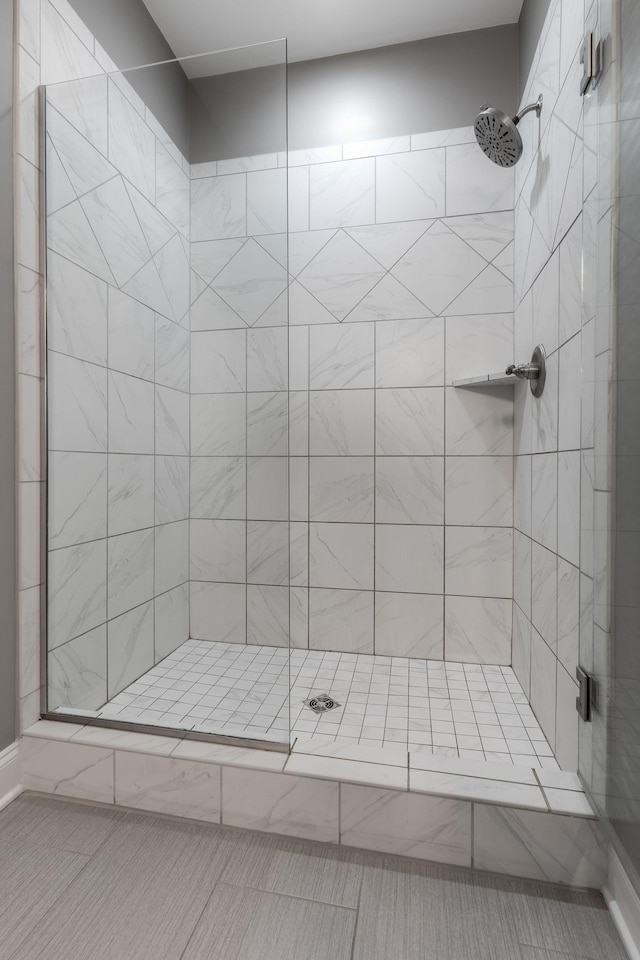 bathroom with tiled shower