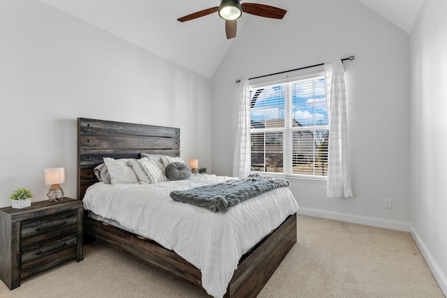 bedroom with ceiling fan, lofted ceiling, and light carpet