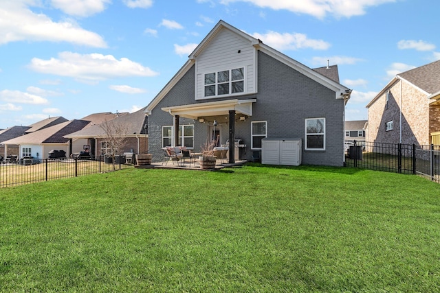 back of property featuring cooling unit, a yard, and a patio