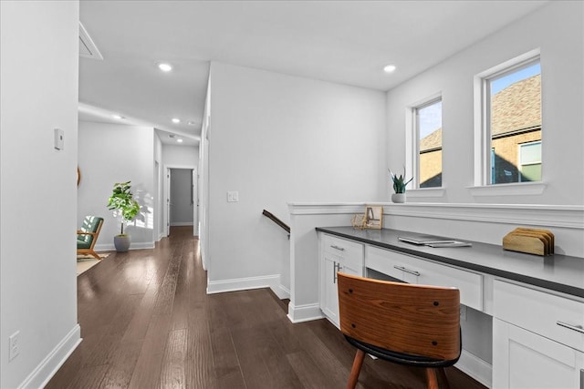 corridor with dark hardwood / wood-style flooring