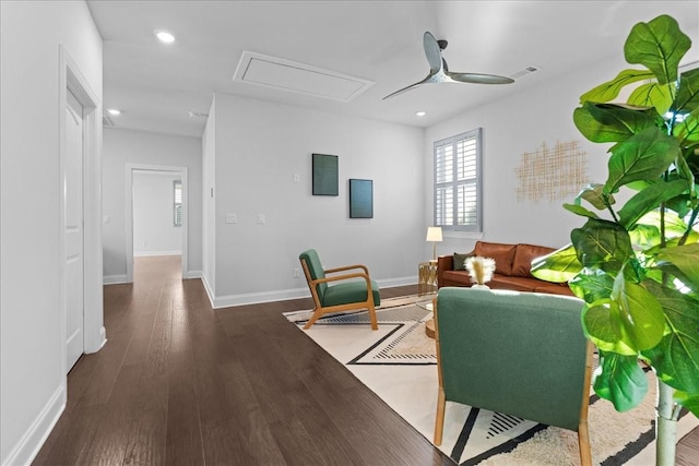 living room with ceiling fan and dark hardwood / wood-style floors