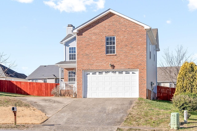 view of front of property with a garage and a front yard