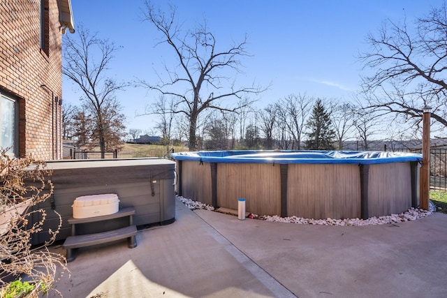 view of patio with a hot tub