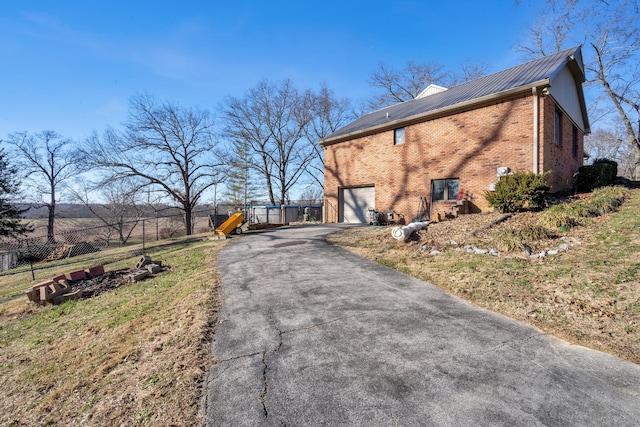 view of property exterior featuring a garage