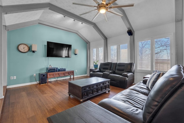 living room featuring wood-type flooring, a textured ceiling, lofted ceiling, and ceiling fan