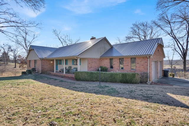 view of front of property with a front lawn and a garage